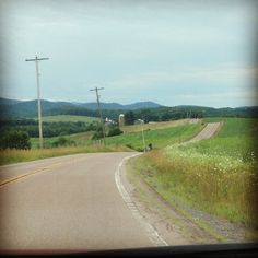 an empty country road in the middle of nowhere