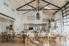 an indoor wedding venue with tables and chairs