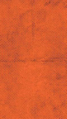 an orange background with black dots