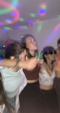 a group of young people dancing at a party