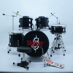 a set of drums and cymbals on a white background with the word shittot written in red