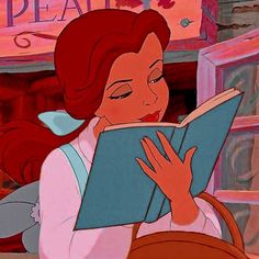 a woman reading a book in front of a window with the words beauty and the beast on it