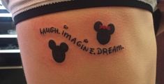 a woman's thigh with two mickey mouse tattoos on her legs that says, high imagine and dream