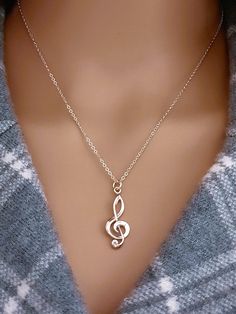 Sterling Silver Treble Clef Music Charm Necklace. The perfect silver charm for music lovers and musicians.  DETAILS » Sterling Silver Treble Clef Music Charm (30mm x 10.5mm including the ring), marked 925 » Sterling Silver Rolo Chain » Jewelry boxes are available at no additional cost ✧ Back to my shop ► http://www.etsy.com/shop/femmeski PLEASE NOTE ►FREE Shipping for all domestic purchases above $35 through USPS ground advantage. ►All photos have been enlarged to show detail, please refer to it Music Note Jewelry, Music Jewelry, Treble Clef, Music Note, Gift For Music Lover, Chain Jewelry, Music Lover, Rolo Chain, Jewelry Boxes