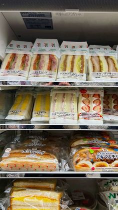 there are many different types of sandwiches on the shelves