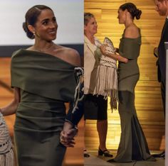 two women in evening dresses talking to each other while one woman is holding her hand out