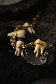 Four Human Teeth - Hand Painted Version- Bracelet, Original Design and Made by Defy Another one of our collection of tooth anatomy jewelry. These teeth are made in details of one, two and three fangs and finished with brass chain for a bracelet, which is adjustable size. Each tooth of this version is finished with acrylic paint and glazed with clear enamel. - The single tooth size : approx. 1.7 x 5 x 1.3 cm. (W X H X D). - The bracelet Circumference adjustable between 16-24 cm. (Free Size) **Ple Human Teeth Jewelry, Teeth Bracelet, Anatomy Jewelry, Tooth Anatomy, Teeth Anatomy, Bumble Bee Jewelry, Bracelet Original, Teeth Art, Human Teeth