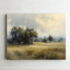 an oil painting of trees and grass in a field with cloudy sky behind it on a white wall