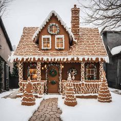 a gingerbread house is decorated for christmas