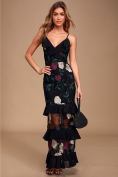 Follow your heart in the Lulus True to Heart Black Floral Embroidered Maxi Dress! Sheer mesh, decorated with cream, plum purple, and green floral embroidery, overlays this elegant maxi dress with a princess seamed, surplice bodice supported by adjustable skinny straps that lace and tie atop an open back. Playful chiffon ruffles add flirty detail along the neckline and throughout the tiered maxi skirt. Hidden back zipper/clasp. Fit: This garment fits true to size. Length: Floor length. Size mediu Wedding Guest Dress Purple, Floral Embroidered Gown, Maxi Dress Floral, Tiered Maxi Skirt, Elegant Maxi Dress, Embroidered Maxi Dress, Adhesive Bra, Follow Your Heart, Chiffon Ruffle