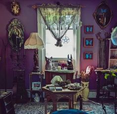 a living room filled with furniture and lots of clutter on top of a rug