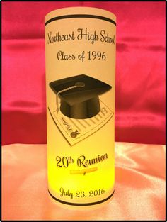 an illuminated bottle with a graduation cap and tassel on the top that reads 20th reunion