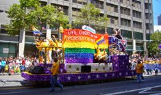 a float with people riding on it in the street