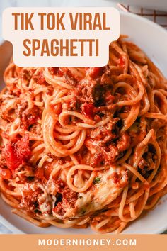 a white plate topped with spaghetti covered in tomato sauce and meat, text reads tik tok vral spachetti