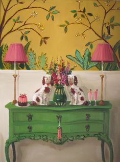 a painting of two dogs sitting on top of a green dresser with pink lamps in front of it