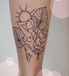 a tattoo on the leg of a woman with flowers and leaves