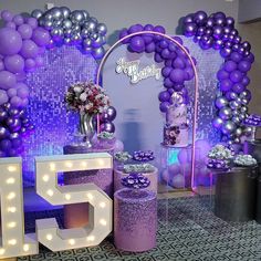 purple and silver decorations for a 50th birthday party