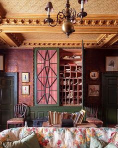 a living room filled with furniture and a chandelier