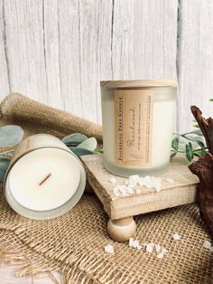 a candle sitting on top of a wooden table