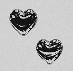 two black and white hearts on a gray background