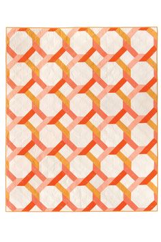 an orange and white quilt with squares on it