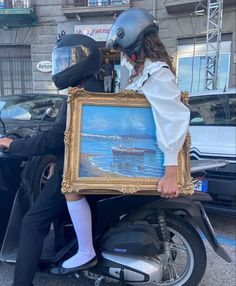 a person on a motorcycle with a painting