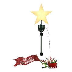 a christmas light with a santa sleigh and star on the pole next to it