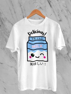 Welcome to our Etsy boutique, where style meets adorable sophistication! Explore our Japanese Kawaii Delicious Milk T-Shirt -- a delightful fusion of Japanese cuteness and contemporary flair. This tee boasts a Delicious Milk illustration featuring irresistibly charming strawberries and the essence of kawaii culture. Crafted from premium materials, this shirt ensures comfort without compromising on style. The Japanese-inspired design adds a touch of playful elegance to your wardrobe, making it a must-have for those who appreciate the art of kawaii fashion. Each shirt is a canvas of sweetness, blending the iconic strawberry motif with the popular Japanese aesthetic. Our Kawaii Delicious Milk T-Shirt is not just a garment; it's a statement. Perfect for casual outings or expressing your unique Cute Cartoon Print Crew Neck T-shirt, Kawaii Cute Crew Neck Tops, Kawaii Crew Neck Top With Cute Design, Cute Kawaii Crew Neck Top, White Harajuku Short Sleeve T-shirt, White Harajuku Style Short Sleeve T-shirt, Cute Crew Neck T-shirt, Kawaii T-shirt With Cartoon Print Crew Neck, Kawaii Crew Neck T-shirt With Cute Design