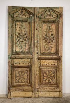 an old wooden door with intricate carvings on it