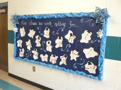 a bulletin board with snowmen on it in a school hallway that says, she came out with nothing for us