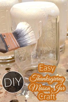 mason jar with a brush in it and the words easy thanksgiving mason jar craft