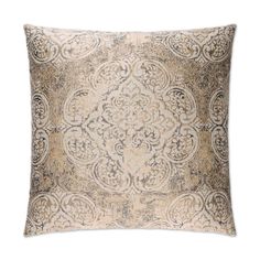 a decorative pillow with an intricate design on the front and back, in beige tones