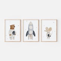 three framed pictures with animals and a rocket ship on the bottom, one in white