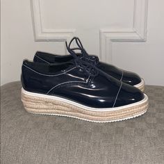 Navy Patent Leather Lace Up Loafers With A Woven Platform Base. Never Worn. Excellent Condition. Summer Office Platform Loafers With Round Toe, Spring Patent Leather Oxfords With Flat Heel, Summer Business Casual Loafers With Round Toe, Summer Business Casual Round Toe Loafers, Spring Patent Leather Round Toe Oxfords, Spring Round Toe Patent Leather Oxfords, Casual Summer Platform Loafers For Work, Spring Patent Leather Oxfords With Almond Toe, Trendy Low-top Spring Platform Loafers