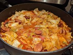 a pan filled with lots of food on top of a stove