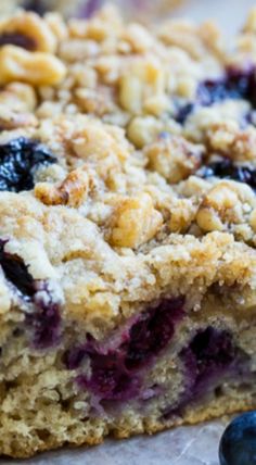 blueberry crumb bars are stacked on top of each other and ready to be eaten