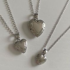 SIZE: chain length is 40cm plus a 5cm extension piece. in the images i am wearing the locket necklace on the last clasp. - small locket: 1 x 1 cm - medium locket: 1.3 x 1.3 cm - large locket: 2 x 2 cm MATERIAL: chain, rings, and charm are all rhodium plated brass (hypoallergenic & tarnish resistant). all materials are from ethical and sustainable sources. POSTAGE INFO: this necklace is handmade with love by me in perth, western australia. PACKAGING: all jewellery is placed inside a storage box and packaged in cardboard and paper packaging. STORAGE & CARE: store your jewellery in a cool, dry place, away from moisture. although all earrings are tarnish resistant, try to avoid contact with chlorinated water and perfumes. MATCHING EARRINGS: https://www.etsy.com/au/listing/1033665816/ Cheap Spiritual Locket Necklace, Luxury Silver Locket Necklace, Cheap Silver Round Locket Necklace, Small Silver Locket, Heart Locket Necklace Silver, Locket Necklace Silver, Silver Heart Locket, Packaging Storage, Large Locket