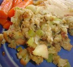 a blue plate topped with meat and vegetables