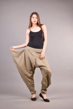 "Linen Harem Pants, Harem Trousers, Baggy Pants, Loose Pants. Extravagant harem trousers with interesting and unusual cut. The baggy pants are loose fit and feature drop crotch. The model is made of linen fabric so it is extremely comfortable women pants suitable for the daytime. If you are looking for the perfect addition to your casual outfit these loose pants are a great choice matched with flats or sneakers. ^ Sizes: The item can be made in sizes from XXS to 7XL. Please, use the size chart b Baggy Full Length Pants With Elastic Waistband, Baggy Khaki Bottoms With Elastic Waistband, Baggy Khaki Wide Leg Pants With Elastic Waistband, Khaki Non-stretch Wide-leg Pants, Baggy Wide Leg Khaki Bottoms, Loose Fit Full Length Khaki Pants, Stretch Khaki Wide-leg Pants, Stretch Khaki Full-length Parachute Pants, Khaki Stretch Full-length Parachute Pants