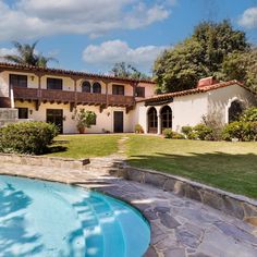 a house with a pool in the front yard