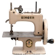 an old singer sewing machine on a white background with the words singer written on it