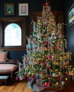 a decorated christmas tree in a living room