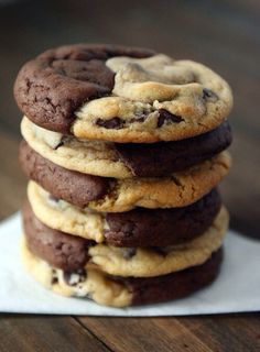 a stack of chocolate chip cookies sitting on top of a napkin