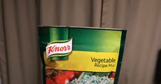 a box of knorr vegetable recipe mix sitting on top of a wooden table