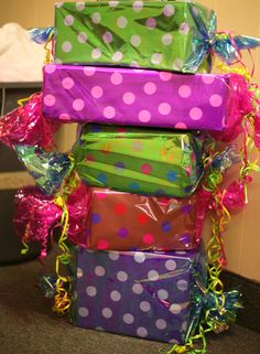 a stack of wrapped presents sitting on top of each other