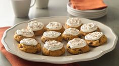 a white plate topped with cookies covered in frosting