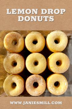 a box filled with glazed donuts sitting on top of a table