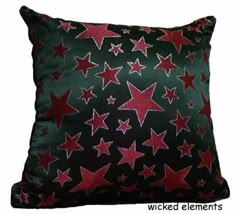 a black pillow with red stars on it