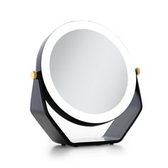 a white and black mirror on a stand