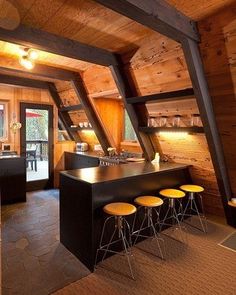 an open kitchen and living room area in a cabin